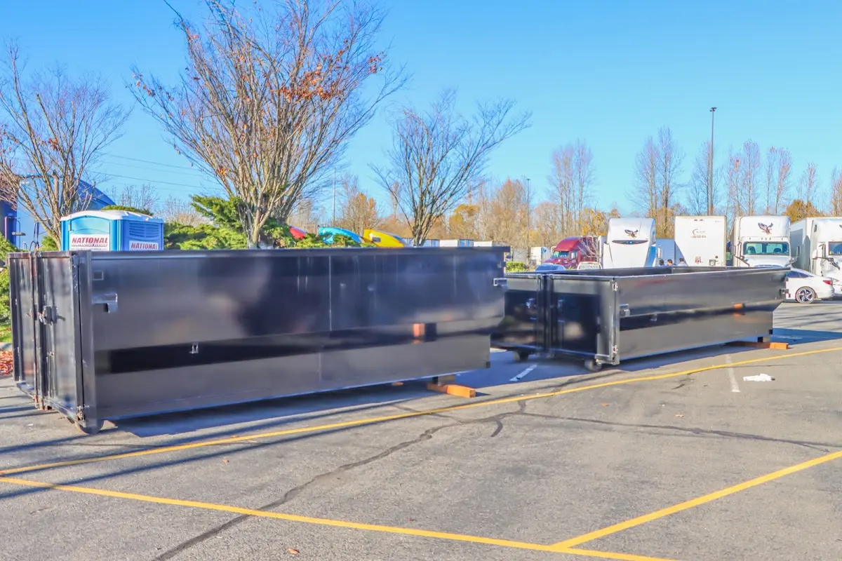 Professional dumpster rental service with roll-off container on residential driveway in La Mirada